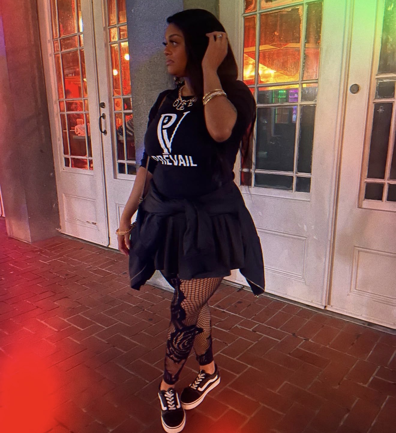Bre wearing a black Prevail shirt.